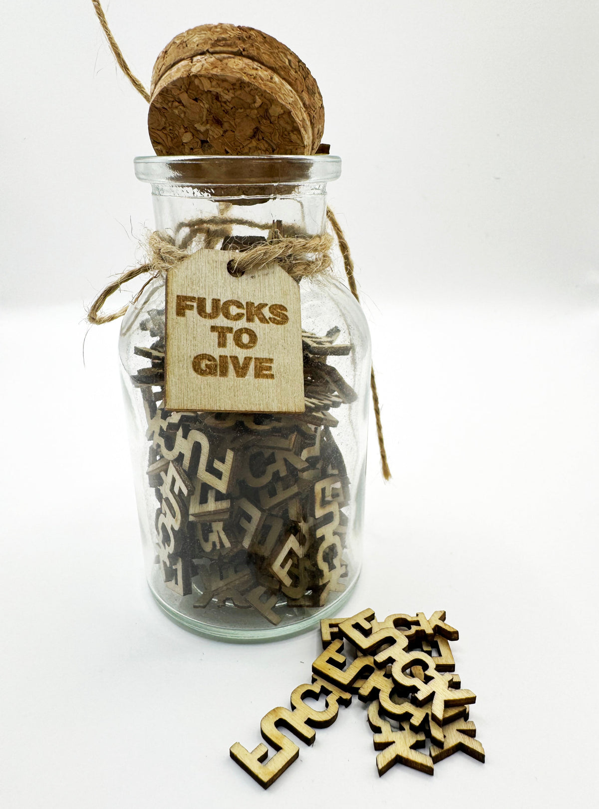 The Swear Jar with wooden letters of 'FUCKS' to Give 
